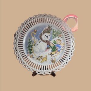 Snowman with kids on a sled decorated plate